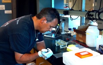 Native American Keith Parker working in a lab.